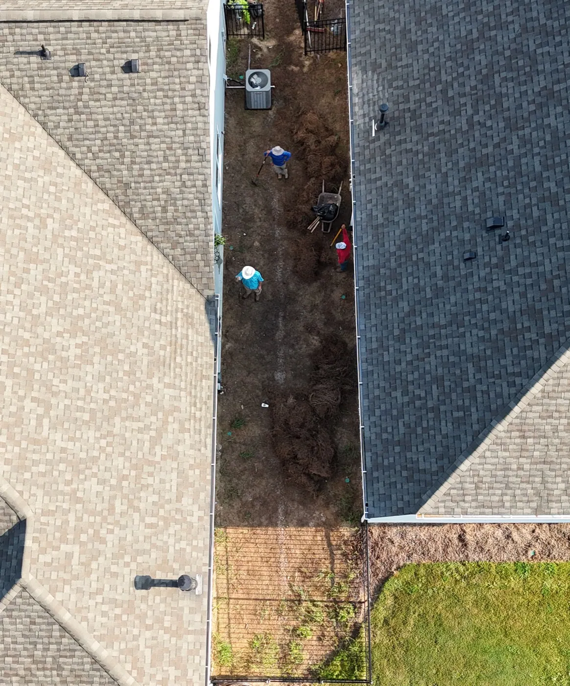 Overhead view of the finished paver passage between the house and fence at the Avery project