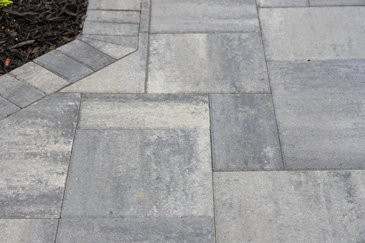 Close view of gray pavers and their joints at the Avery project