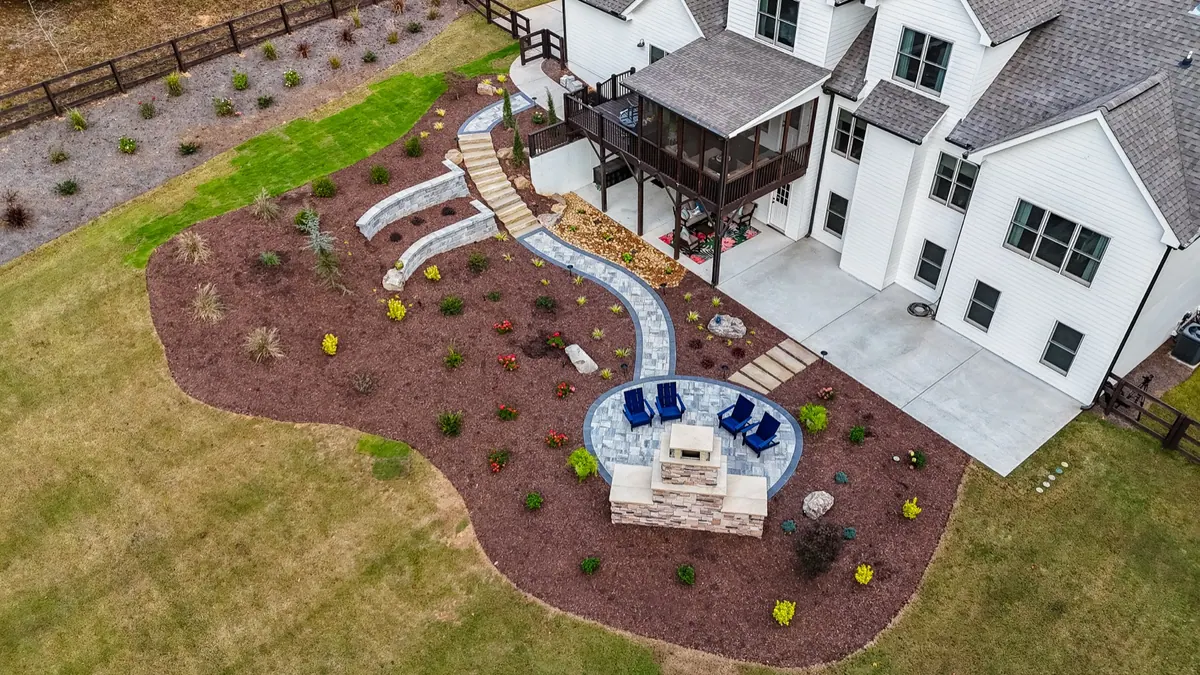 Aerial view of the S-curve paver path and fireplace patio at the Ball Ground project
