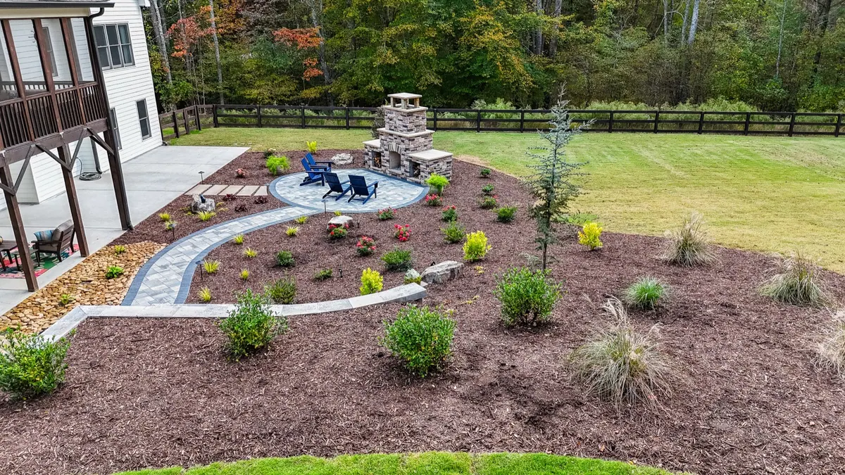 The finished Ball Ground fireplace and patio from across the lawn