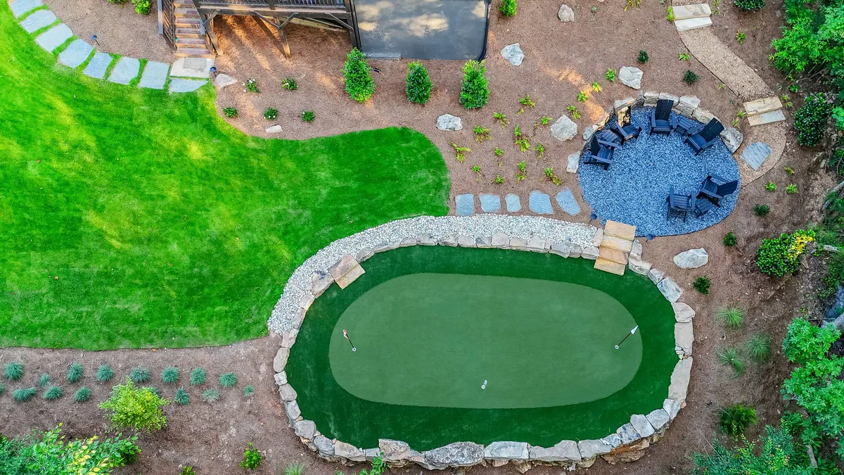 After: drone view of the putting green, seating terrace, and stepping-stone path