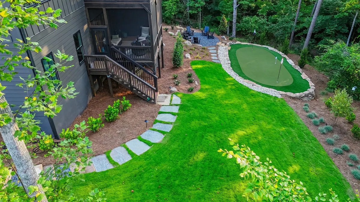 Aerial view of the Blueberry Ridge build in Milton: putting green, boulder walls, and new lawn