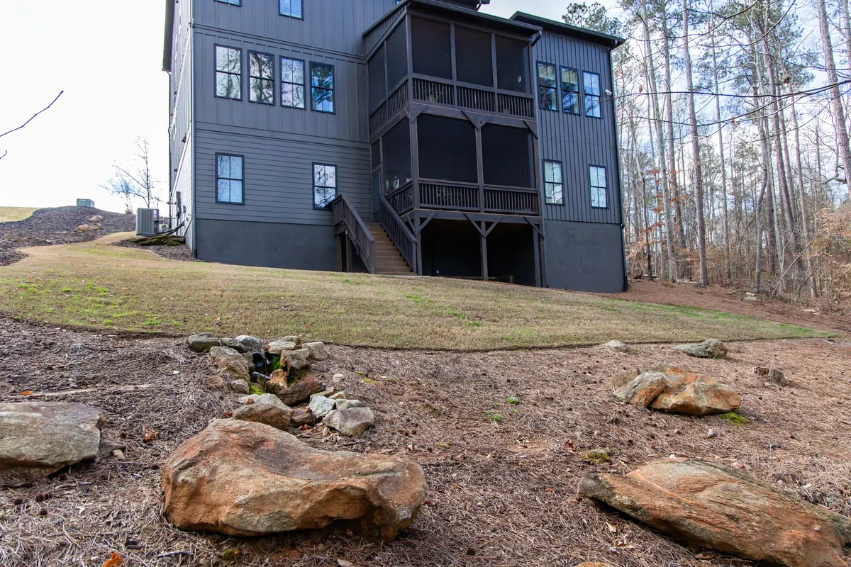 Before: the bare, eroding hillside behind the Milton home, nothing but graded clay and scattered boulders