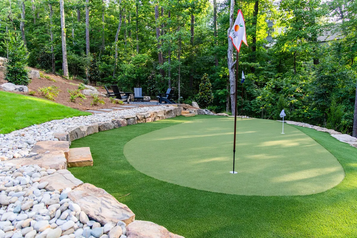 Putting green flag and boulder edge detail at the Blueberry Ridge project in Milton