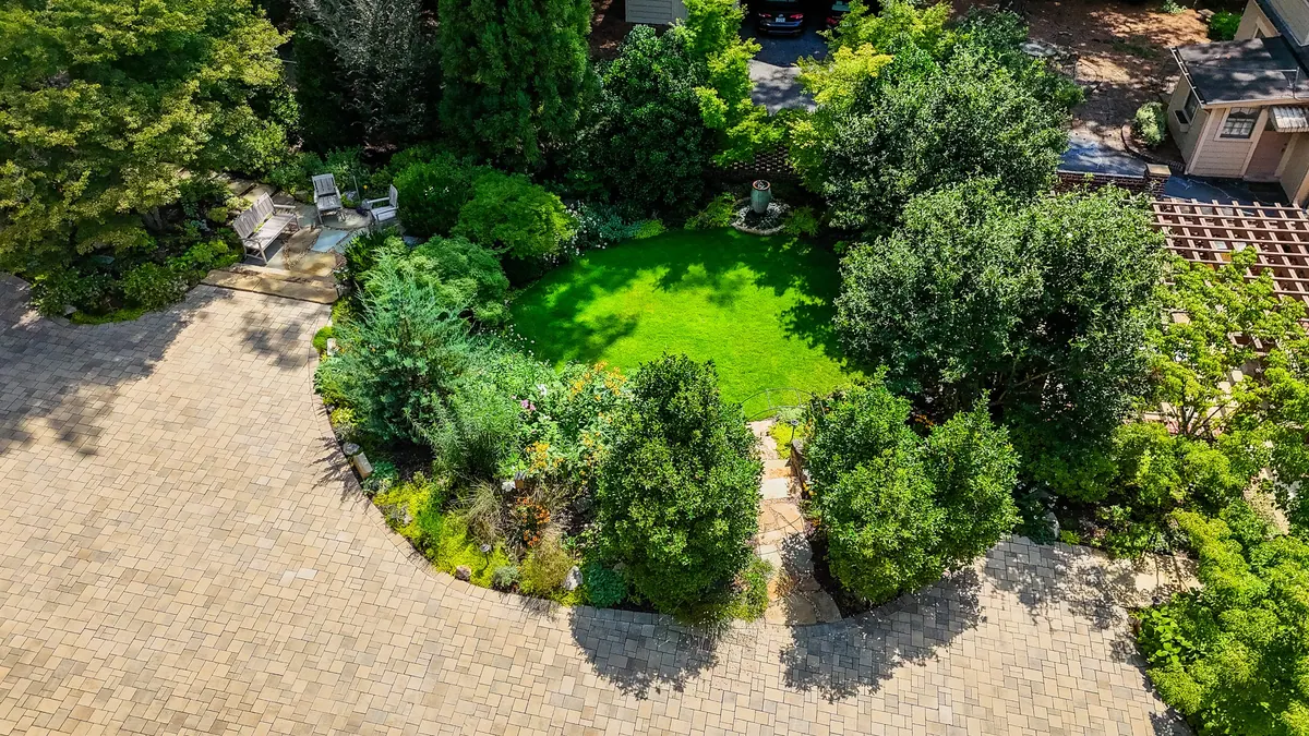 Overhead view of clipped shrubs, planting beds, and garden paths at Eulalia Road