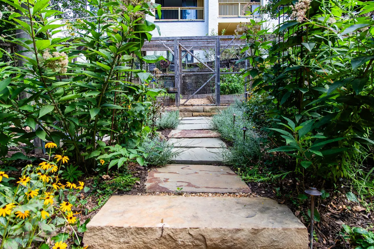 Steps leading through flower beds to the kitchen-garden gate