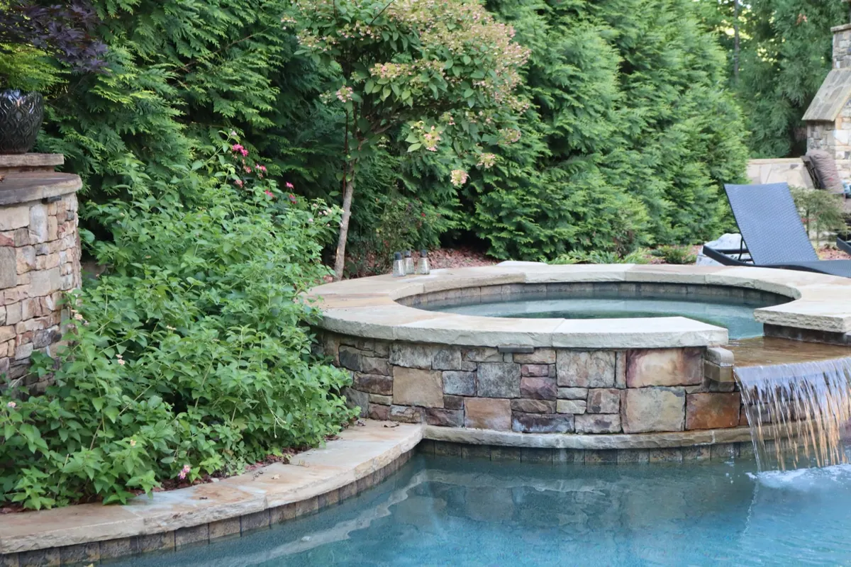 Stone waterfall and spa on a GreenTree pool build