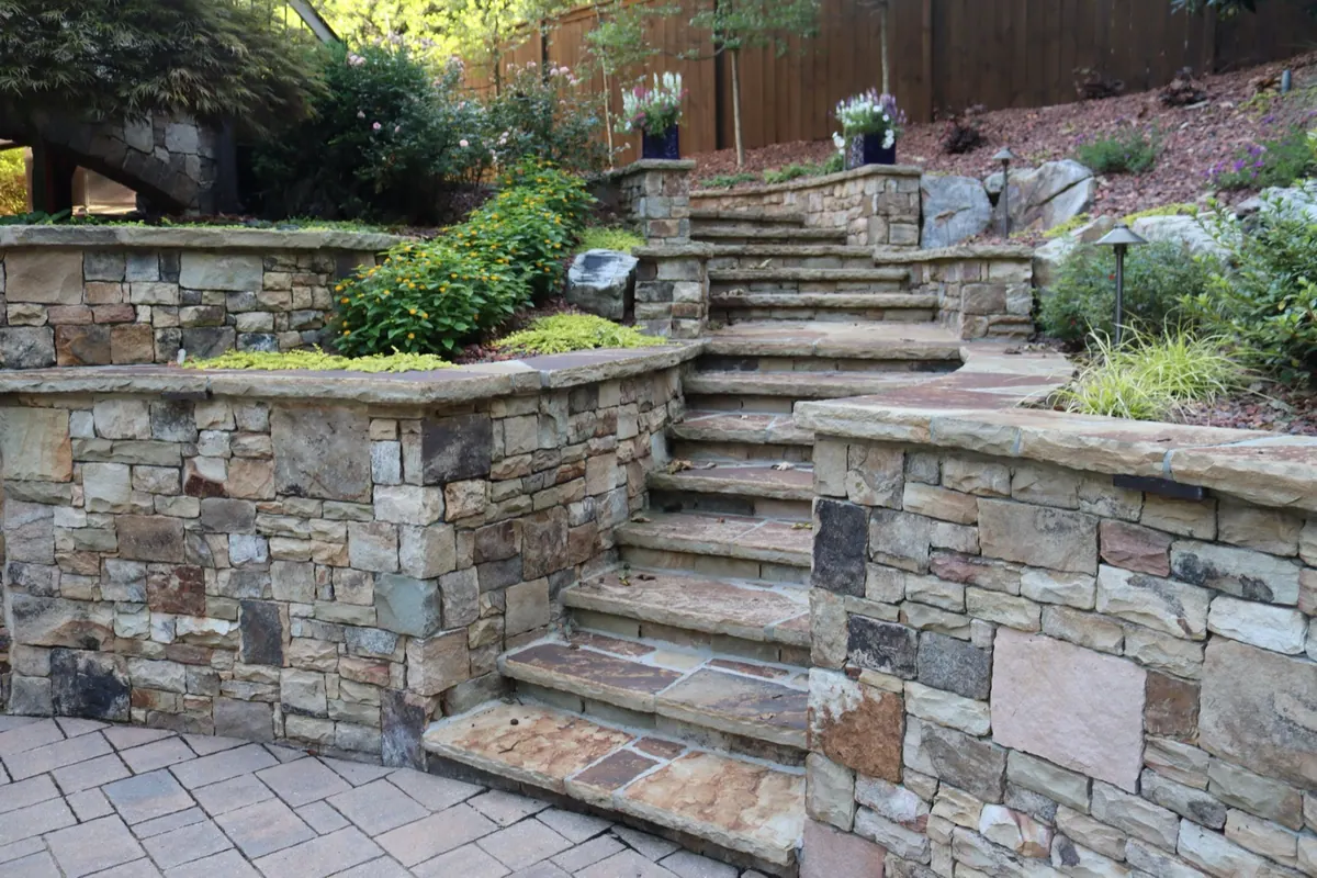 Multi-tier stone staircase and retaining walls