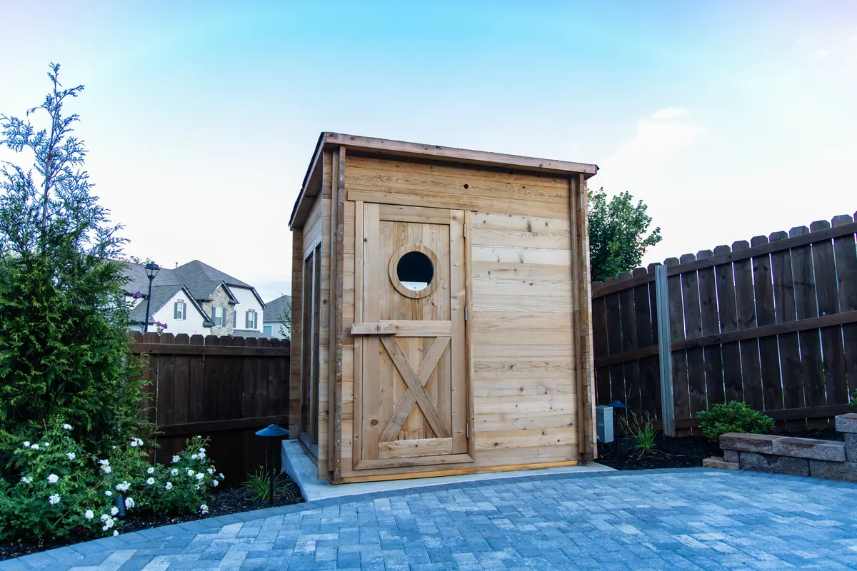 Cedar sauna on a paver patio at the Fulton Estate
